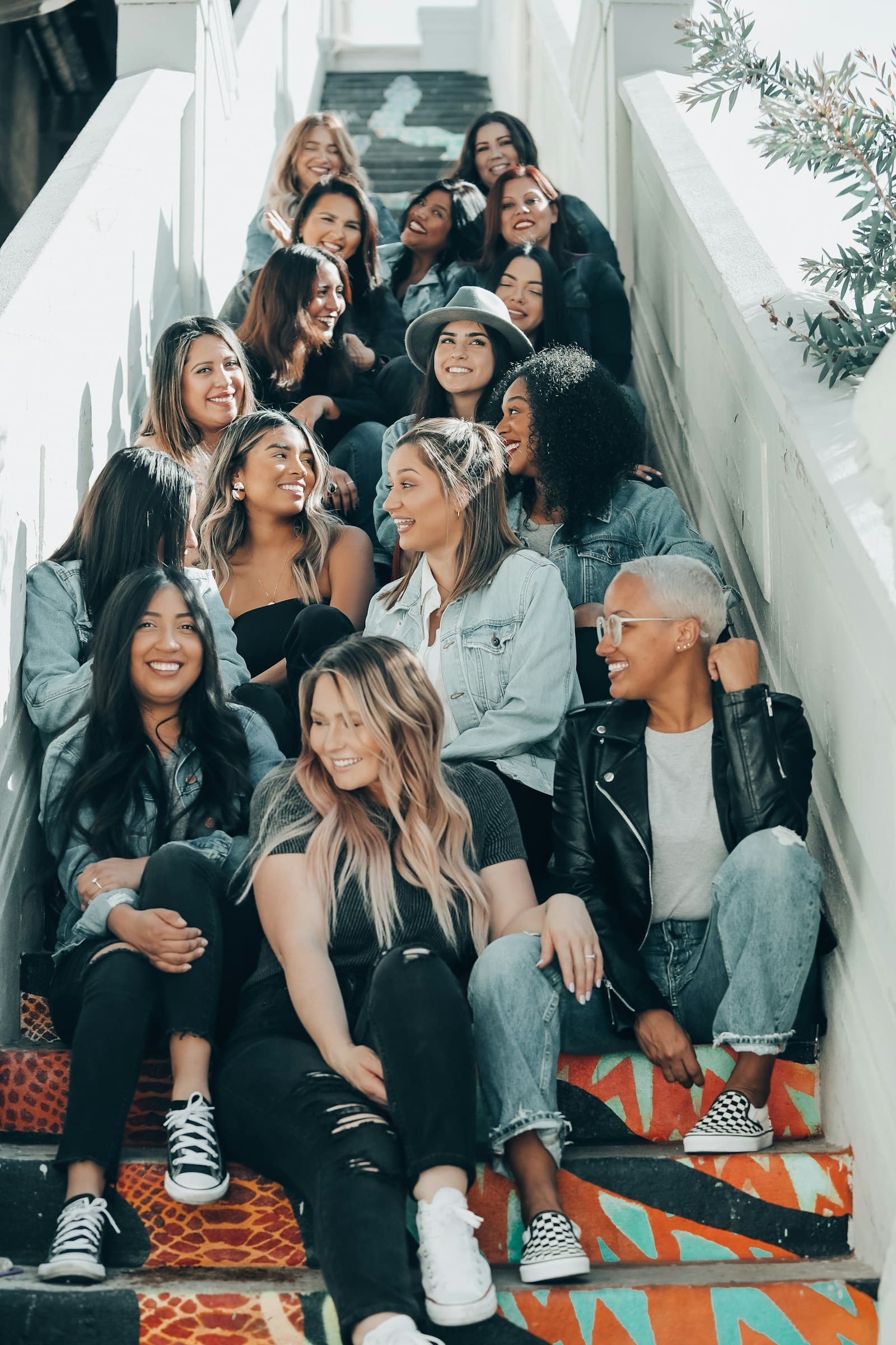 A group of friends sitting together on concrete stairs